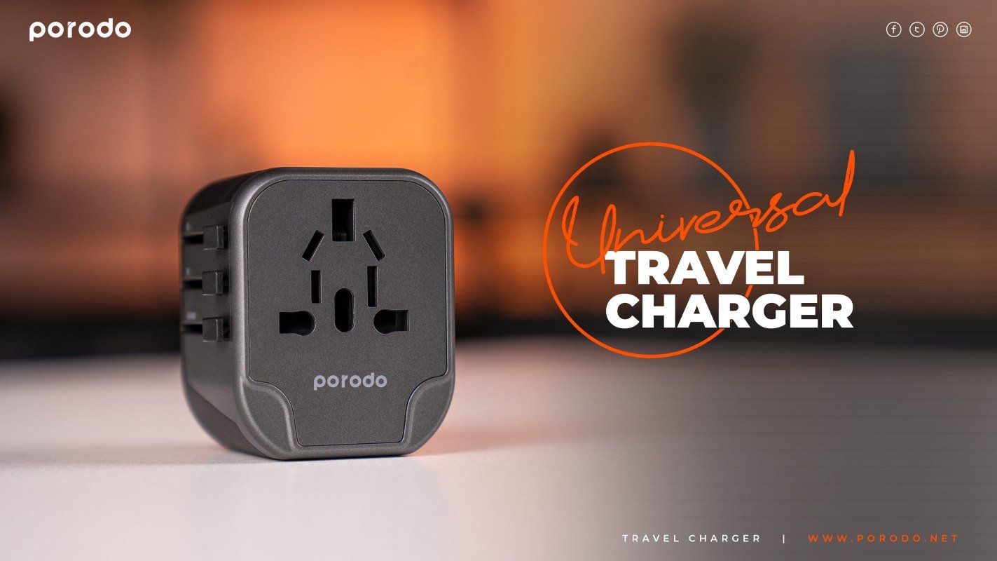 alt="Universal travel charger placed on top of table"