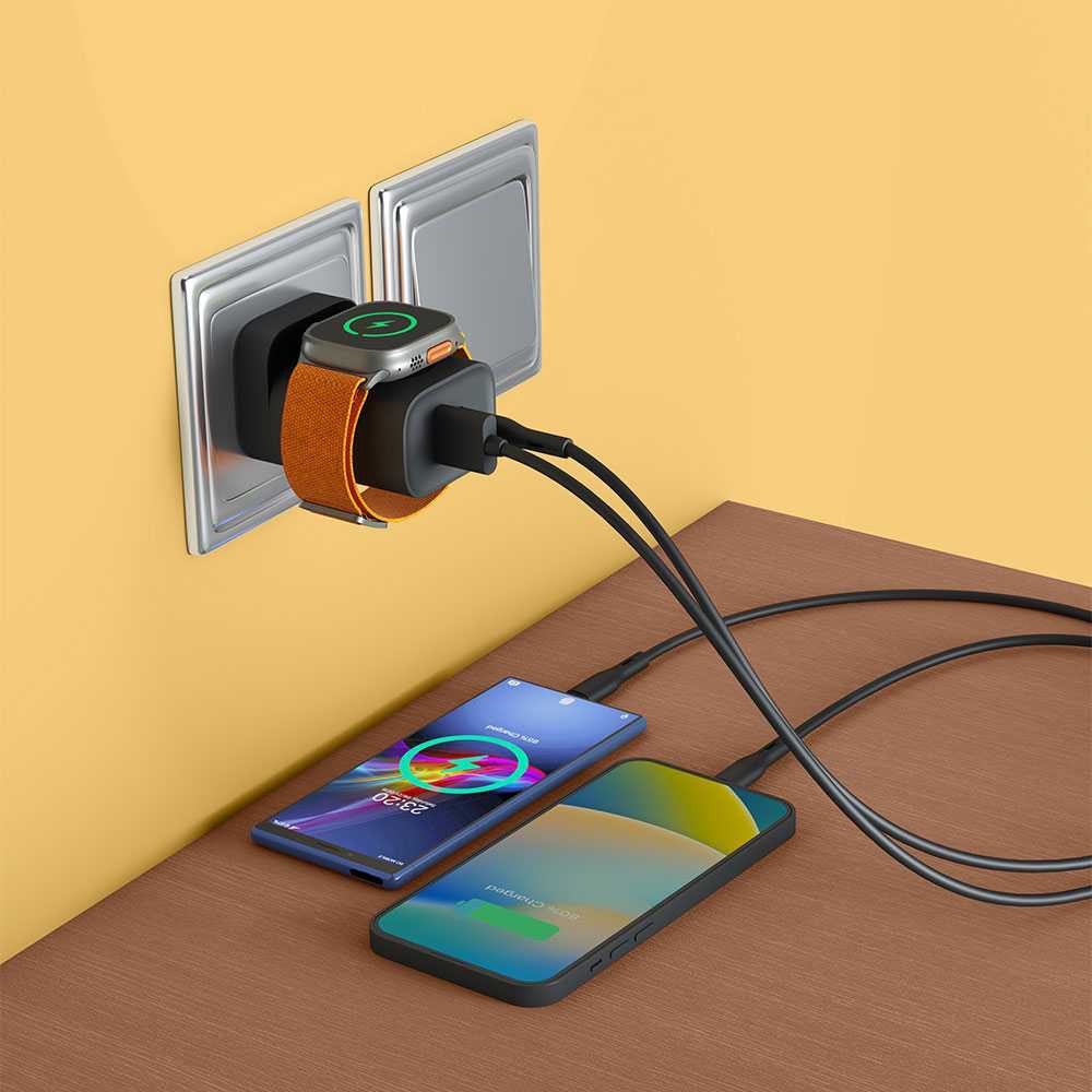 alt="Charger plugged into wall to charge three devices at once"
